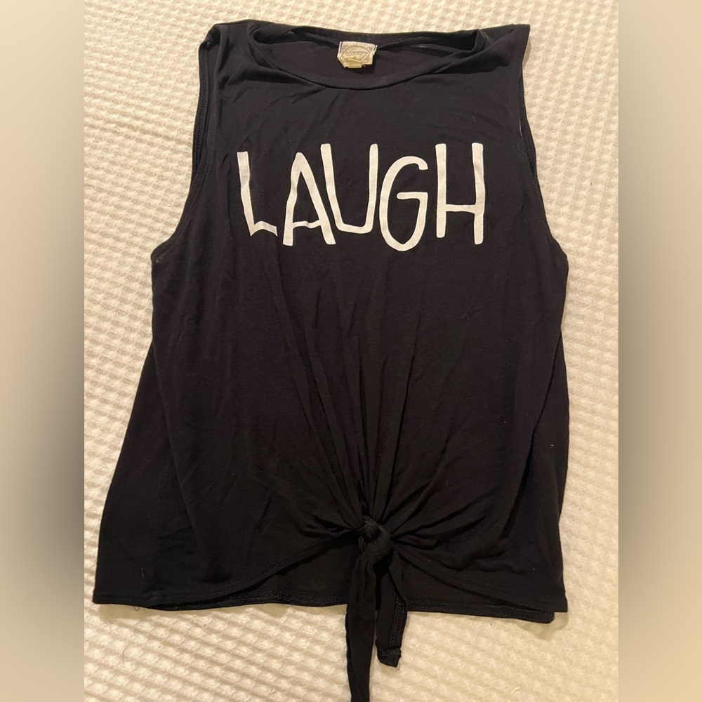 Dirtee Laundry Black Tank with 'LAUGH' Graphic and knot at bottom.